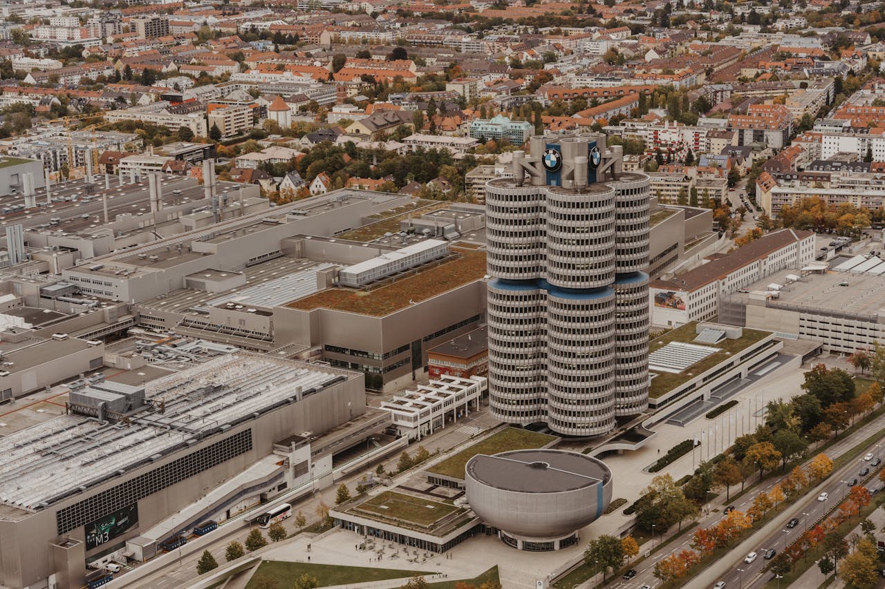 digital-01 Aerial view of BMW headquarters in Munich, showcasing the iconic four-cylinder building.
